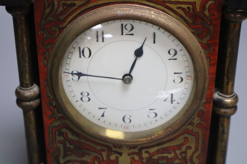 A small 19th century French timepiece, of rectangular form with ebonised and boulle work case and gilt brass mounts, integral key, heig